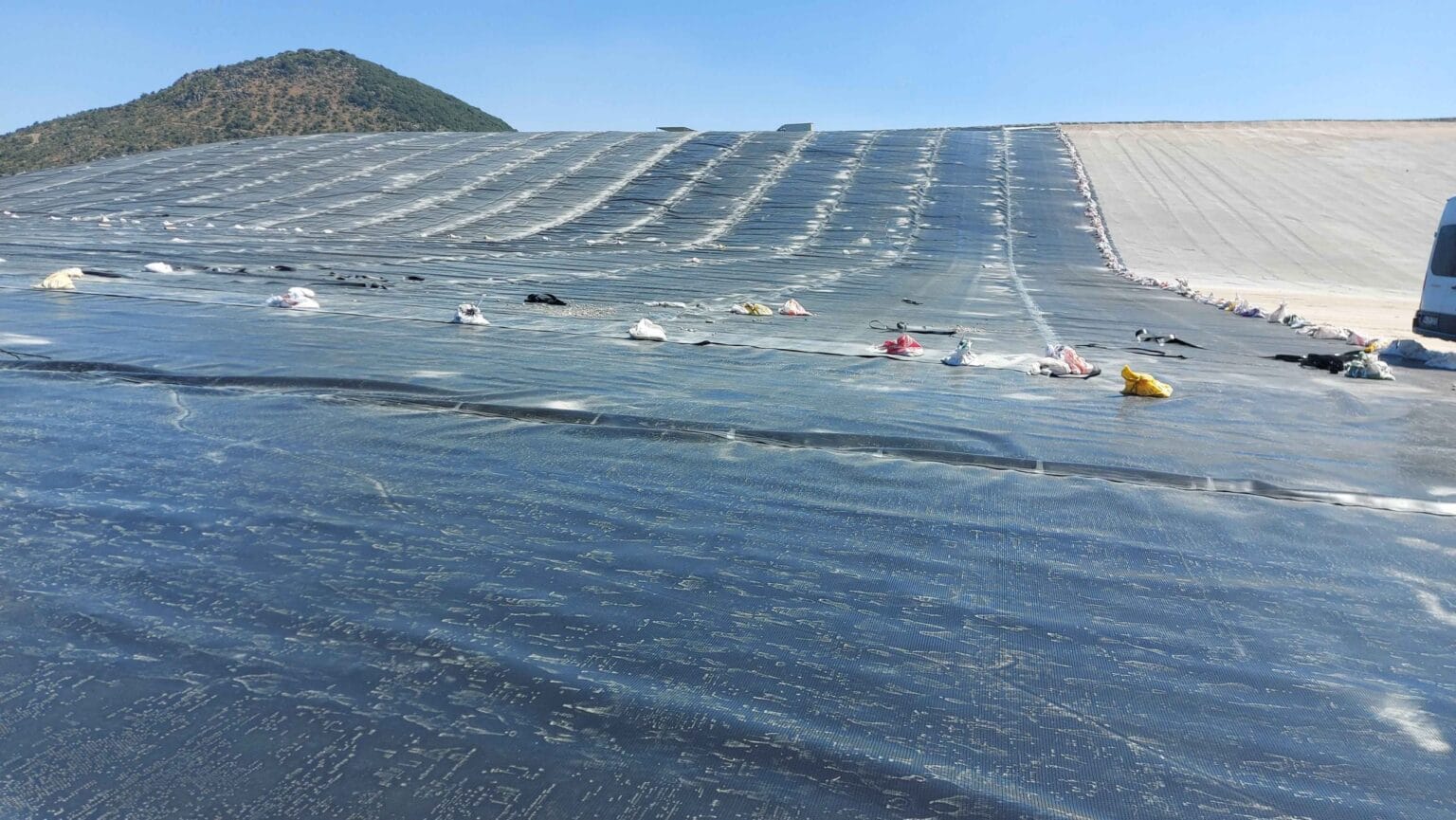 Geomembrane deployment and welding work on the slope of Kışladağ Gold Mine heap leach pad